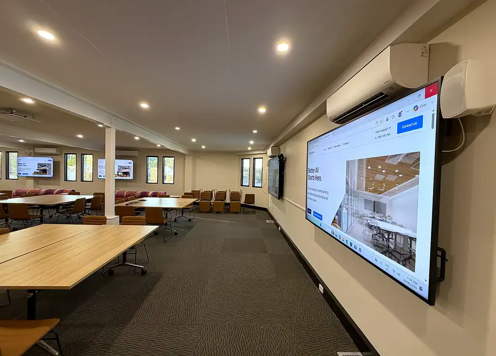 KWHB training-room display, wall speaker and conferencing camera