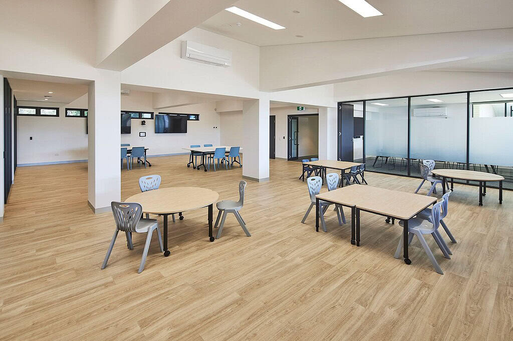Flexible hall at Aspect Vern Barnett School with presentation displays and meeting tables